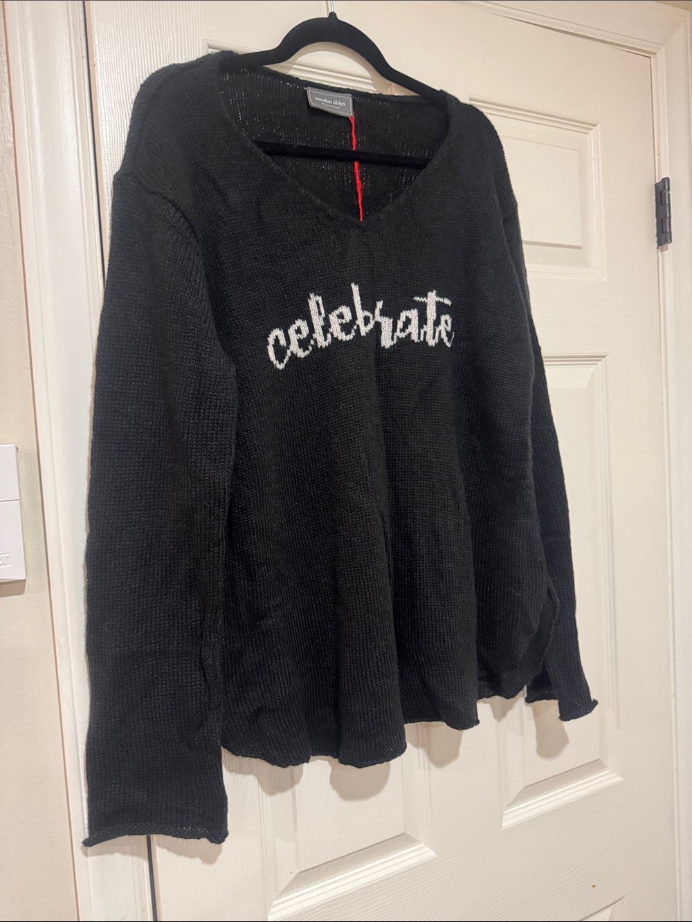 Wooden Ships/Light Weight Black V-Neck Sweater/White Script, “Celebrate.”NWT!